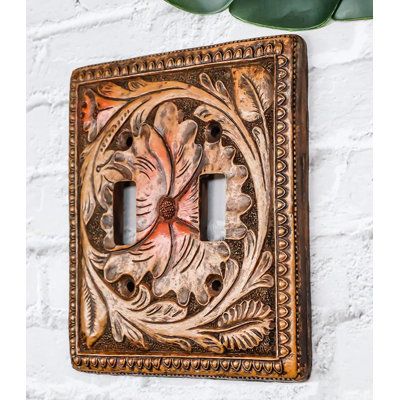 This Western Faux Wooden Tooled Floral Blossoms Wall Electrical Cover Plates each measures 5.25" High, 4.75" Wide and 0.25" thick approximately. They fit standard wall receptacles. Each plate weighs about 5 ounces. | Bungalow Rose Ramonita 2-Gang Duplex Outlet Wall Plate in Brown / Orange | 6 H x 5 W x 1 D in | Wayfair Faux Wood Wall, Pine Tree Silhouette, Custom Leather Work, Horse Wall, Toggle Switch, Wooden Background, Western Decor, Wall Plate, Switch Plates