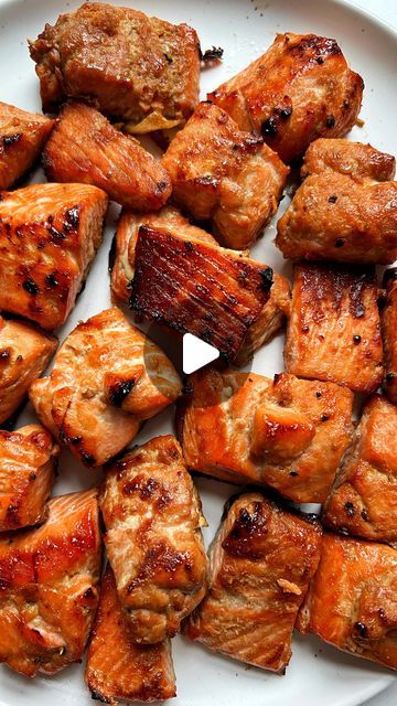 rachel on Instagram: "follow @rachlmansfield for more easy recipes🫶🏻  omg these 10-MINUTE AIR FRYER SALMON BITES! crispy on the outside and buttery in the center👌🏻this is my favorite way to make salmon right now and it’s incredibly easy and soooo good.  *SAVE* this post to make later + let me know if you try it too😎we are hooked over here .. definitely going to try other sauces and flavor spins on it too soon.   INGREDIENTS: 1 lb salmon fillets  1/3 cup coconut aminos  2 tablespoons honey mustard  1/2 teaspoon garlic powder  1/2 teaspoon ginger sea salt and black pepper to taste   HOW TO: 1. warm a baking sheet in the oven at 400 degrees (this helps get the salmon extra crispy) 2. whisk together marinade ingredients  3. slice the salmon into cubes (you can take off skin if you want) 4 Air Fryer Salmon, Salmon Bites, Honey Salmon, Coconut Aminos, Too Soon, Salmon Fillets, Honey Mustard, 10 Minute, Baking Sheet