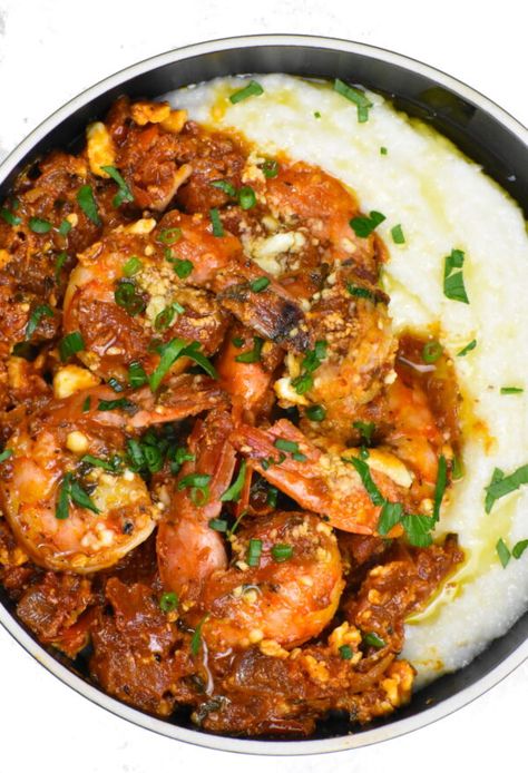 Plump shrimp in a beautifully flavored tomato sauce, topped with feta and served atop a creamy bed of grits. Shrimp Saganaki, Jambalaya Soup, Greek Shrimp, Southern Squash Casserole, Food Shrimp, Harissa Recipes, Shrimp N Grits Recipe, Shrimp And Sausage, Grits Recipe