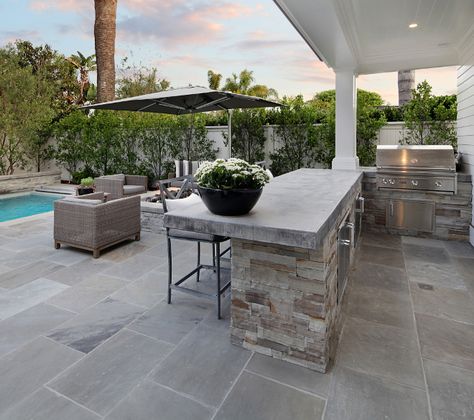 Outdoor Kitchen. The outdoor kitchen features concrete countertop and stone. These pavers are a natural stone called Shadow Gray. Outdoor Kitchen Outdoor Kitchen Ideas. Outdoor Kitchen Layout #OutdoorKitchen Brandon Architects, Inc California Ranch Style Homes, Concrete Countertops Outdoor, Outdoor Kitchen Countertops, California Ranch, Outdoor Kitchen Bars, Grill Area, Outdoor Kitchen Appliances, Outdoor Kitchen Design Layout, Concrete Kitchen