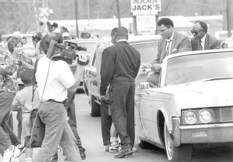 A parade makes its way down Main Street in Kountze in this Enterprise file photo dated March 19, 1994. When people saw the guest of honor, Muhammad Ali, they naturally tried to get close enough for an autograph or a handshake. Ali's people tried to hold them back, but some got through. You can see here that Ali is signing something. Kountze Mayor Charles Bilal is sitting next to Ali. Photo: Enterprise File Mississippi Blues, Bad Image, Blues Musicians, Country Blue, Chronicle Books, Methodist Church, Blues Music, Backyard Party, Muhammad Ali