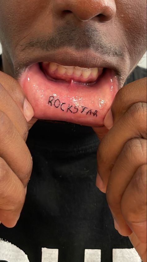 Lip Tattoo Men, Mouth Tattoo Inner Lip, Lower Lip Tattoo, Inner Lip Tattoo Words, Underlip Tattoo, Under Lip Tattoo, Bottom Lip Tattoo, Rockstar Tattoo Ideas, Inner Lip Tattoo Ideas