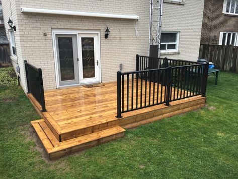 Open Deck Ideas Backyards, Deck Leading To Patio, Small Deck Off Back Of House, Front Yard Floating Deck, Deck Ground Level, Replace Deck With Patio, Flat Wood Deck Patio, Deck With Aluminum Railing, Small Deck With Large Patio