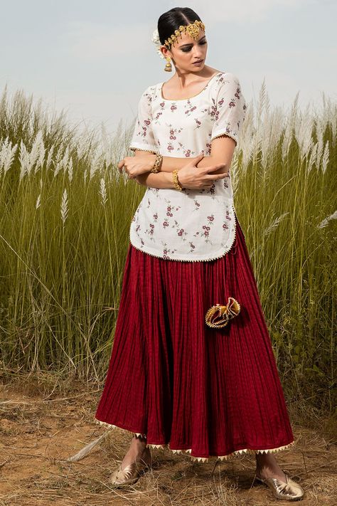 Featuring an ivory kurta in handcrafted cotton base with floral print. It is paired with a contrasting scarlet gharara and a dupatta.  FIT: Fitted at bust and waist. COMPOSITION: Handcrafted cotton. CARE: Dry clean only. India Shopping, Decorative Tassels, Short Kurti, Kurti Set, Ankle Length Skirt, Hand Woven Textiles, Indian Fashion Designers, Vintage Floral Print, Pernia Pop Up Shop