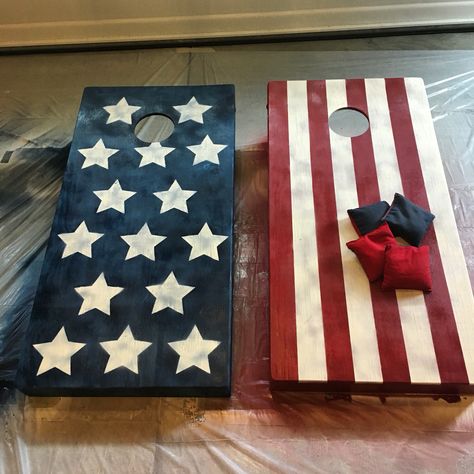 American flag cornhole boards  I painted these weathered cornhole boards to go for a rustic American flag look! Flag Cornhole Boards, American Flag Cornhole Boards, Diy Cornhole Boards, Cornhole Boards Designs, Corn Hole Diy, Cornhole Designs, Rustic American Flag, Cornhole Game, Wooden Home