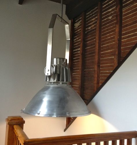 exposed lath wall and industrial light in stairwell Exposed Lathe Wall, Light In Stairwell, Stairs And Living Room, Lath Wall, Diy Lathe, Industrial Glam, Industrial Light, Home Stairs Design, Victorian House