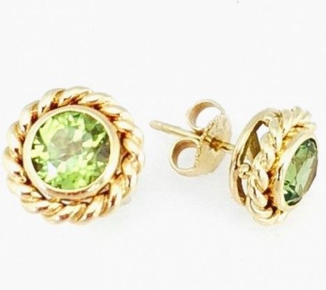 Tiffany & Co. Yellow Gold Peridot Stud Earrings.  Tiffany & Co. 18K Yellow Gold Bezel Set Braided Peridot  Stud Earrings with Friction Posts.  Two round peridot +/- 1.00 cts.each Measures approx. 5/8" diameter. 2.8 dwt.   Matching Peridot Pendant available WOO943. Item Number: WOO942 Earrings Tiffany, Tiffany Earrings, Peridot Pendant, Studs Earrings, Bezel Setting, Tiffany & Co., Item Number, Beautiful Jewelry, Yellow Gold