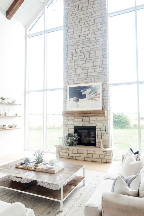 Coffee Table White Couch, Fireplace Between Windows, Fireplace Refresh, Big Windows Living Room, Cathedral Ceiling Living Room, Coastal Farmhouse Living Room, Fireplace Windows, Vaulted Ceiling Living Room, Coastal Farmhouse Style