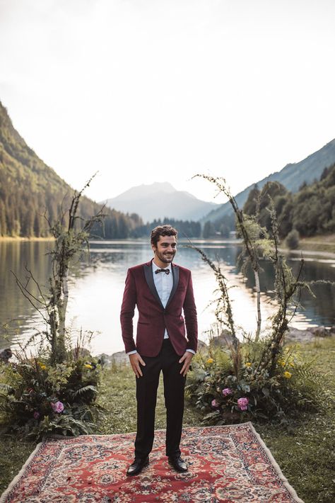 Groom Suit Red Burgundy Velvet Jacket Bow Tie French Alps Folk Boho Mountain Wedding Ideas Katja & Simon Photography #bowtie #velvet #jacket #red #burgundy #Groom #Suit #Trousers #wedding #groomsmen Groom Suit Red, Boho Mountain Wedding, Boho Wedding Groomsmen, Romantic Wedding Setting, Mountain Wedding Ideas, Boho Mountain, Modern Groom, Groomsmen Bowtie, Mountain Weddings