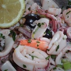 Sliced squid is tossed with a lemon juice, garlic, and celery mixture! Calamari Salad, Feast Of Seven Fishes, Sea Food Salad, Squid Salad, Calamari Recipes, Squid Recipes, Sea Food Salad Recipes, 7 Fishes, Seven Fishes