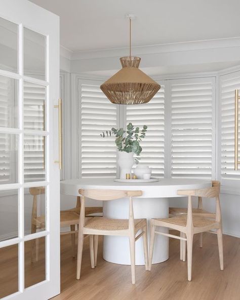 HAAUS.® on Instagram: "It’s absolutely crazy to look at the difference in our #haaus3 dining room. So much so, you would be forgiven if you thought it was an entirely different space. We wanted to stick with the ‘coastal feel’ throughout the home so we used timbers and whites then added greenery for an added pop of colour. To ensure natural light flowed from the living area through to the dining, we installed a pair of French doors from @humedoors. They look amazing and are very cost effect Wicker Accents, Dulux White, Net Pattern, Rattan Weave, Natural Flooring, Shutter Doors, White Pendant Light, Reclaimed Timber, White Doors