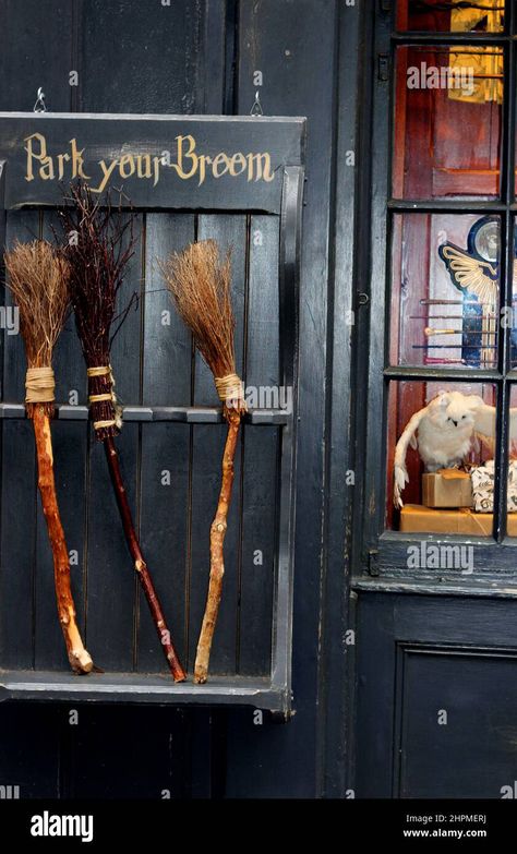 Download this stock image: Broom parking outside a shop in York, England. The crooked paths of the Shambles have attracted numerous shops related to Harry Potter and wizardry - 2HPMERJ from Alamy's library of millions of high resolution stock photos, illustrations and vectors. Broomstick Harry Potter, Halloween Broom Parking, Broom Parking, Witch Broom Parking, Harry Potter Park, Harry Potter Broomstick, Witch Broom Parking Sign, Witch Hut, York England