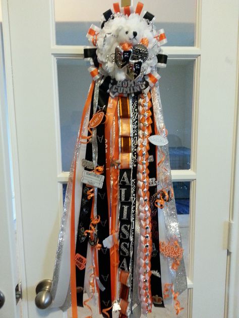 Orange, black, white, and silver theater arts themed homecoming mum Orange Black And White Homecoming Mums, Orange And Black Homecoming Mums, Mum Inspiration, Big Homecoming Mums, Texas Homecoming Mums, Mum Ideas, White Mums, Homecoming Mums Diy, Fair Projects