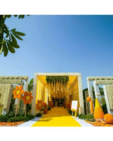 Dreamy Haldi Entrance Decor Haldi Entrance Decor, Haldi Entrance, Entrance Seating, Haldi Backdrop, Floral Backdrop Wedding, Haldi Decoration Ideas, Haldi Decoration, Red Wedding Decorations, Wedding Car Decorations