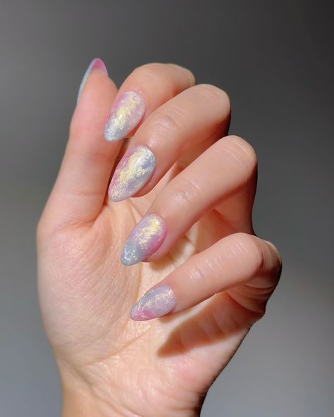 🫧Twilight Aura- These premium handmade press-on nails feature a mesmerizing blend of soft pastels with an iridescent finish, capturing the dreamy colors of twilight for an enchanting and ethereal look. 🛍️ nomoodnails.com #nomoodnails #pressonnails #pressons #almondnails #shortnails #fyp #handmadenails Iridescent Pearl Nails, White Iridescent Nails Acrylic, Iridescent Nail Designs, Pearlescent Nails, Ethereal Nails, Dreamy Colors, Iridescent Pearl, Pearl Nails, Luxury Nails