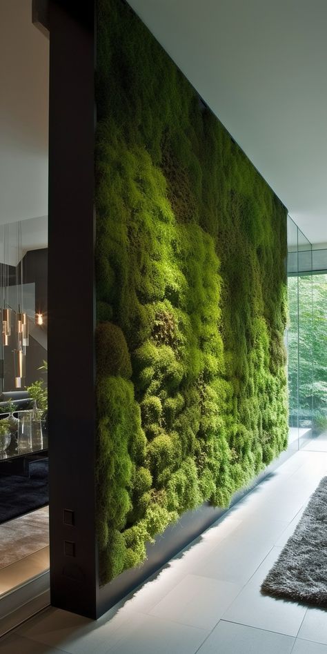 An elegant moss wall room divider, uniting the beauty of nature and contemporary design to create a serene, functional partition in an indoor space. Green Moss Wall, Office Living Wall, Moss Wall Ideas, Greenwall Interior Design, Green Wall Partition, Fake Living Wall, Greenwall Interior, Room With Lots Of Plants, Garden Design Rooftop