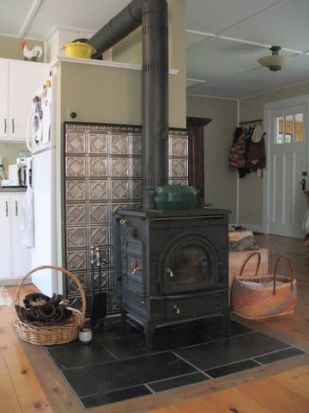 Wood stove - tin tile wall Wood Stove Surround, Vehicle Camping, Stove Decor, Wood Stove Hearth, Truck House, Stove Backsplash, Wood Stove Fireplace, Wood Heater, Tin Tiles