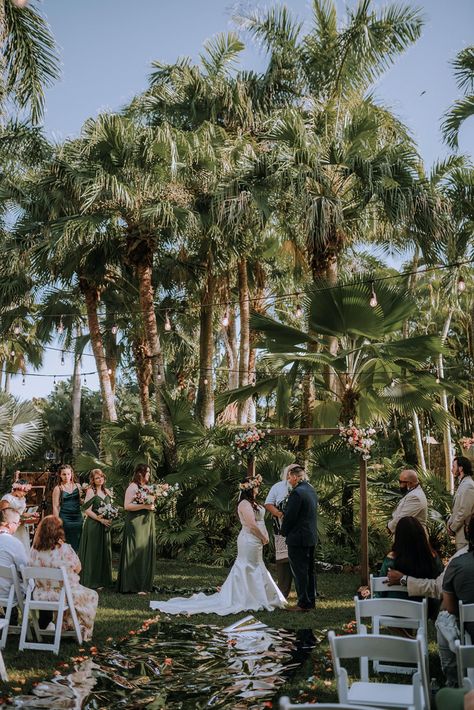 Obsessed with this outdoor tropical garden wedding in Oahu, Hawaii! This private estate wedding started with the most beautiful outdoor ceremony in the garden! They incorporated tropical decor, string lights and a wooden ceremony arch to tie in the tropical theme! Find the full day on the blog & how to book me! Anela Benavides - Hawaii Wedding Photographer Tropical Garden Wedding, Hale Koa, Whimsical Wedding Inspiration, Big Island Wedding, Wedding Hawaii, Private Estate Wedding, Hawaii Destination Wedding, Book Me, Maui Weddings