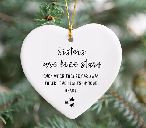 You Will Love This Unique and Thoughtful "Sisters are like stars" Heart Ornament. This makes a perfect Holiday Keepsake For Sisters! Product Details->  ►► MATERIALS:  White Ceramic Ornament  ►► SIZE: Approximately 0.125" x 3.20" x 2.9" ►► GIFT BOX: These custom ornaments arrive in a white gift box          and come with a hanging hole large enough to fit ribbon or          string.  ►► Printed on One side with permanent sublimation ink ►► DELIVERY TIME Each ornament is individually made for you. Christmas Gift For Sister, Sister Ornament, Sister Best Friend, Christmas Gifts For Sister, Custom Ornaments, Christmas Event, Long Distance Gifts, Gift For Sister, Ceramic Gifts