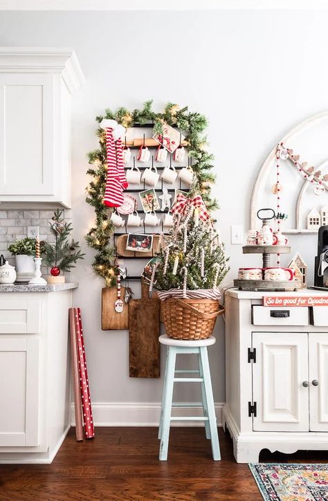 Creative ways to display collections and make a statement for the seasons, using a mug rack as inspiration! More ideas at diybeautify.com #mugrack #homedecorideas Christmas Mug Rack, Christmas Coffee Mug Display, Christmas Mug Display Ideas, Santa Mugs Display, Christmas Stocking Display Ideas, Christmas Mug Display, Display Collections, Lighted Garland, Hanging Mugs