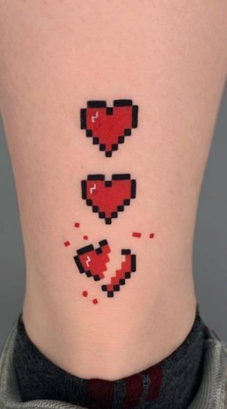 In this article, we collected meaningfully broken heart tattoos for the skin if you want to tell the world about the heartbreak experience. Check it to inspire trendy designs and ideas. Pixel Heart Tattoo, Real Heart Tattoos, Goth Symbols, Dreams Tattoo, Neck Tattoo Women, Pixel Tattoo, Themed Tattoos, Zelda Tattoo, Gamer Tattoos