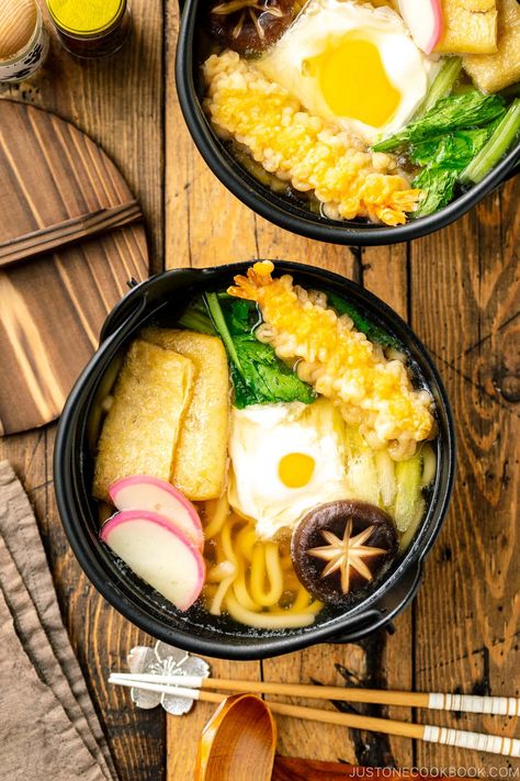 Served in an individual donabe clay pot, Nabeyaki Udon is a winter staple in Japan. Thick chewy udon noodles are cooked in a flavorful dashi broth along with kamaboko fish cake, fried tofu, scallions, and an egg. Put the crispy shrimp tempura on top to make it extra fancy or keep it simple with what you have in the fridge. This recipe is easily customizable! #nabeyakiudon #udon | Easy Japanese Recipes at JustOneCookbook.com Nabeyaki Udon, Tempura Udon, Tempura Recipe, Deep Fried Tofu, Dashi Broth, Easy Japanese Recipes, Crispy Shrimp, Shrimp Tempura, Frozen Shrimp