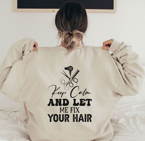 42.00 USD Hair Stylist Sweatshirts Hoodies Crewneck Hooded For Women Cosmetology Plus Size Hoodie Shirts Beautician Hairstylist Gifts for Her Introducing our Hair Stylist Sweatshirt - the perfect addition to any cosmetologist or hairstylist's wardrobe! This comfortable and stylish sweatshirt features a fun and playful message on the back that reads "Keep Calm and Let Me Cut Your Hair." Crafted with high-quality materials, this sweatshirt is not only stylish but also comfortable to wear. The… Hair Message, Hairstylist Gifts, Handyman Shirt, Plus Size Hoodie, Funny Gifts For Him, Work Hairstyles, Cozy Fabric, Cosmetology, Boys Shirts