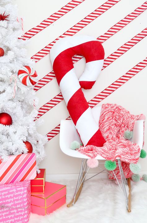 Make a Festive Giant Candy Cane Pillow for Christmas. Get the simple tutorial to make this fun, fluffy, oversized candy cane for your couch! Candy Cane Pillow, Diy Christmas Photoshoot, Giant Candy Cane, Christmas Candy Cane Decorations, Candy Cane Crafts, Giant Candy, Christmas Sewing Projects, Candy Cane Ornament, Candy Cane Christmas