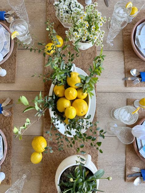 A Creative Spring Tablescape with a Lemon Theme Spring Fling Party, Lemon Tablescape, Unusual Centerpieces, Blue And White Plates, Terra Cotta Plant, Lime Green Weddings, Plate Chargers, White Salad, Plant Saucers