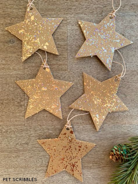 Glitter Cardboard Star Ornaments look stunning made with a unique glitter paint you will love! Diy Star Ornaments Homemade Christmas, Cardboard Xmas Decorations, Star Ornaments Diy, Cardboard Stars, Cardboard Ornaments, Cardboard Star, Homemade Decorations, Star Craft, Christmas Star Decorations