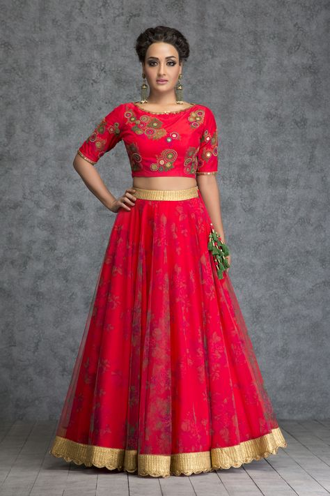 Being married or getting married is the best feeling in the world which comes with an added excitement of trousseau hunting. This knot stitched coin embroidered scarlet red silk crop top with printed tulle skirt is one of the most ultimate looks for the new bride. Add that extra radiance for your first 'karvachatuh'. - See more at: https://www.vemanya.com Partywear Dresses Indian, Skirt And Crop Top Indian, Crop Top Indian, Boat Neck Crop Top, Crop Top Lehenga, Indian Skirt, Tulle Long Skirt, Embroidered Lehenga, Desi Style