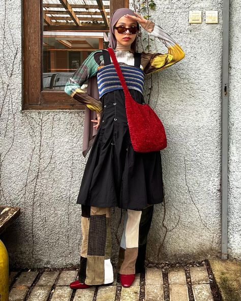 i love texture, i love colors and i love mixing em both together ✨✨✨ outfit deetz: inner pleated top —— @arthurapparel stripes tube top —— gifted black dress —— thrifted pants —— thrifted bag —— @dualekat shoes —— @berlynnshoes . . . . . . . . . outfit repeater. outfit rotation. color blocking. layering styles. modest fashion. red bag. dress over pants. pattern clashing. vintage clothing. thrifted fashion. secondhand fashion. pleated top. Y2K trend. Thrifted Outfits Vintage, Pattern Clashing, Thrifted Pants, Outfit Rotation, Outfit Repeater, Thrifted Fashion, Dress Over Pants, Striped Tube Top, Thrifted Outfits