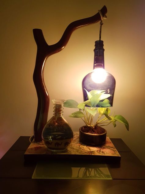 Indoor Plant Living Room, Whisky Bottle Crafts, Old Liquor Bottle Ideas, Plant Living Room Decor, Diy Bedside Lamp, Liqour Bottles, Plant Living Room, Old Liquor Bottles, Empty Liquor Bottles