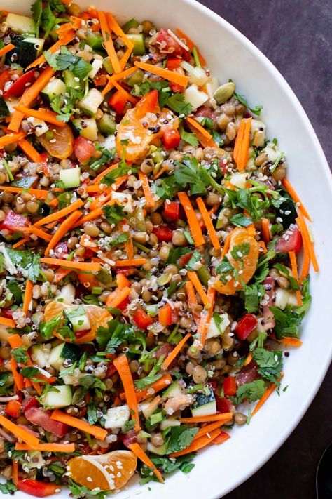 This lentil quinoa salad is packed with fresh, summery textures and flavors! The zesty dressing pairs perfectly with lots of crunchy veggies such as zucchini, peppers, carrots, hearty lentils and quinoa and sweet orange slices for a one-bowl burst of flavor meal that you can even make ahead. Glutenfree Soyfree Nutfree Quinoa Lentil Recipes, Lentil Quinoa, Lentil Salad Recipes, Lentils And Quinoa, Make Ahead Salads, Vegan Salad Dressing, Vegan Entree, Quinoa Salad Recipes, Lentil Salad