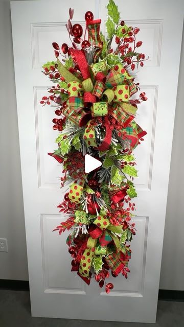 Julie Lockman Siomacco on Instagram: "OMG Garland! 😱 This garland turned swag wreath for door can be used where you need a bigger impact for the holidays! I had fun teaching our members this one. We also discussed shopping for supplies, shipping this and why getting out of your comfort zone is a growth opportunity.  What do you think of this swag? #wreath #christmaswreath #wreathmaking #silkflowers #doorwreaths #flowers" How To Make Swag Wreath, How To Make A Swag Wreath Tutorials, Christmas Door Swags Diy Front Porches, Christmas Swag Wreath, Diy Christmas Swags For Front Door, Tear Drop Wreath Diy Christmas Swags, Diy Christmas Swag How To Make, Door Swag Diy How To Make, Diy Swag Wreath