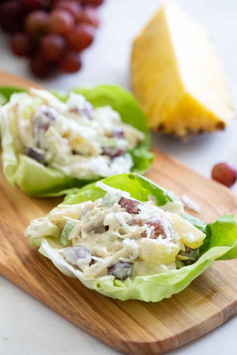 Chicken salad with an island twist - these Tropical Chicken Lettuce Wraps are filled with chicken, pineapple, grapes, and coconut with a creamy sauce to make the perfect lettuce wraps. #recipe #chickensalad #chickenwrap #tropical #shreddedchicken #dinnerrecipe #lunchrecipe Hawaiian Chicken Salad, Tropical Chicken, Vegetarian Wraps, Lettuce Wraps Recipe, Asian Chicken Lettuce Wraps, Chicken Pineapple, Chicken Caesar Wrap, Island Twist, Chicken Lettuce Wraps Recipe