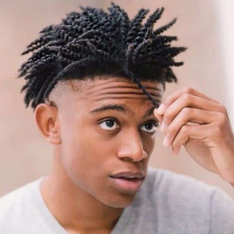 A black man wearing a twist out hair on top paired with a clean shaved low undercut Short Hair Twist Styles, Blonde Dreadlocks, Natural Hair Men, Braid Styles For Men, Dreadlock Hairstyles For Men, Black Men Haircuts, Twist Styles, Black Men Hairstyles, Bald Fade