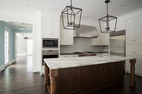 Beautiful kitchen features white shaker cabinets paired with black quartz countertops and a white linear tiled backsplash. Frosted Glass Pantry Door, Corner Kitchen Pantry, Kitchen Pantry Doors, Light Grey Kitchens, Glass Pantry Door, Grey Kitchen Island, Craftsman Homes, Kitchen Island Bench, Corner Pantry