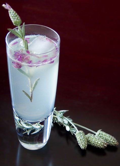 The classic Tom Collins gin cocktail gets a spring makeover with a touch of lavender. Get the recipe at 12 Bottle Bar.    - Redbook.com Lavender Collins, Flower Drinks, Drink Garnishing, Outdoor Cocktail, Gin Drinks, Spring Cocktails, Gin Fizz, Garden Cafe, Food Garnishes