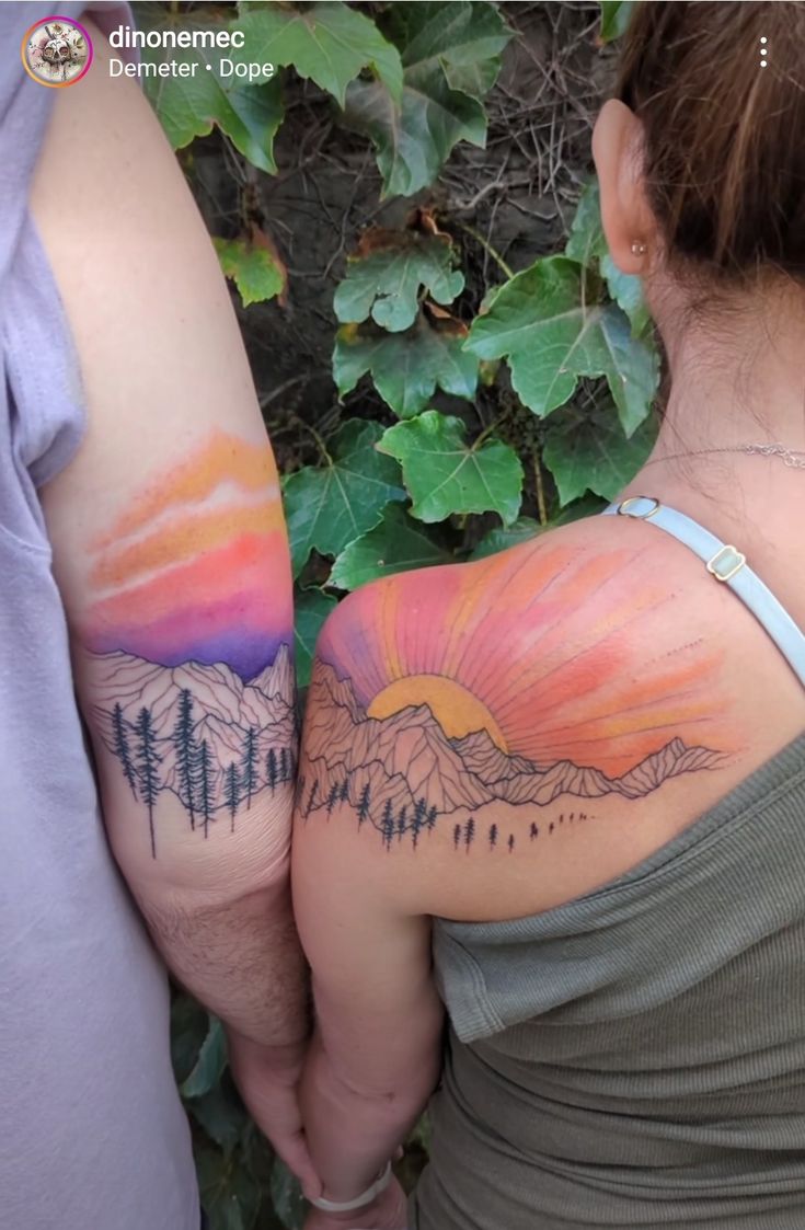 two people with tattoos on their arms, one is holding the other's arm