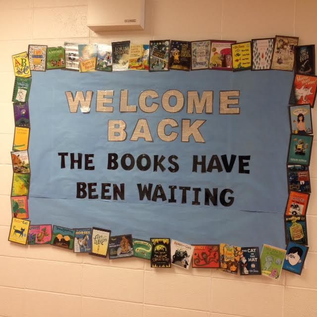 a welcome back sign is displayed on the wall in a school hallway, with books have been waiting