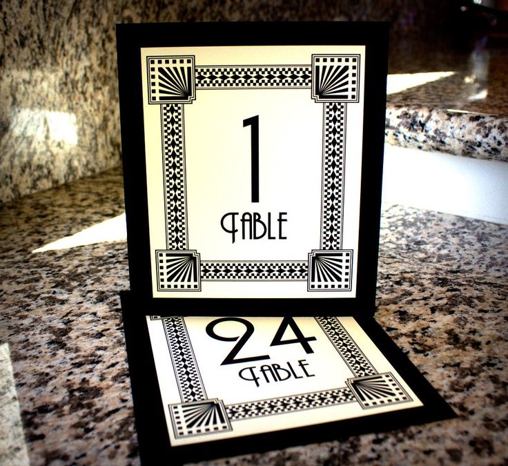 a table number is displayed on top of a marble countertop in a hotel lobby