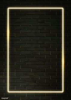 an empty square neon frame on a black brick wall with the light coming from behind it