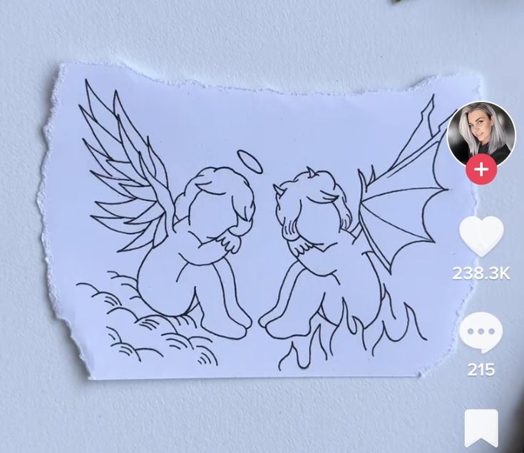 an image of two cherubs on a piece of paper