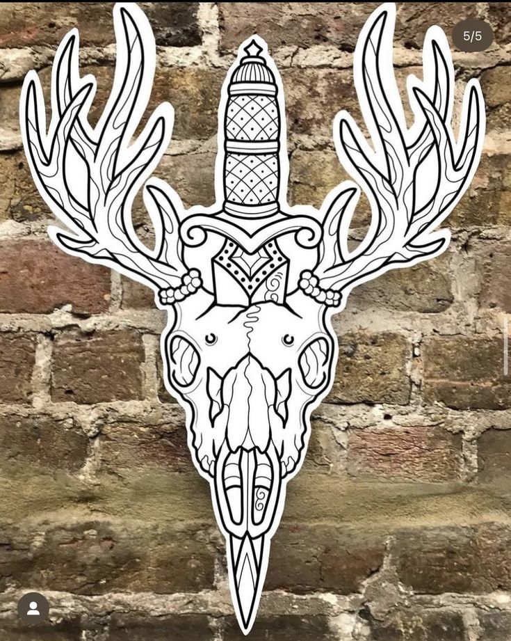 a sticker with an image of a deer's head and a lighthouse on it