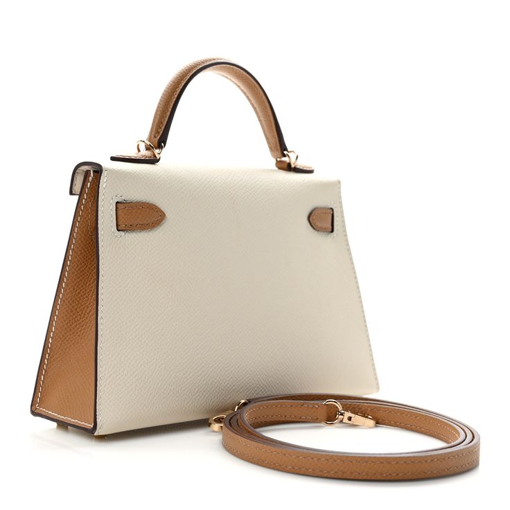 This is an authentic HERMES Epsom Horseshoe Mini Kelly Sellier 20 in Craie and Biscuit. This stunning handbag is crafted in stamped epsom calfskin leather in ivory and tan. A single rolled leather top handle is secured with gold plated hardware and an optional leather shoulder strap is included. The traditional Kelly turn lock secures the small flap. The interior features a matching chevre goatskin leather with a single flat pocket. Hermes Crossbody Bag, Mini Kelly, Kelly Sellier, Plastic Stickers, Hermes Bags, Bag Straps, Leather Top, Top Handle, Calf Skin