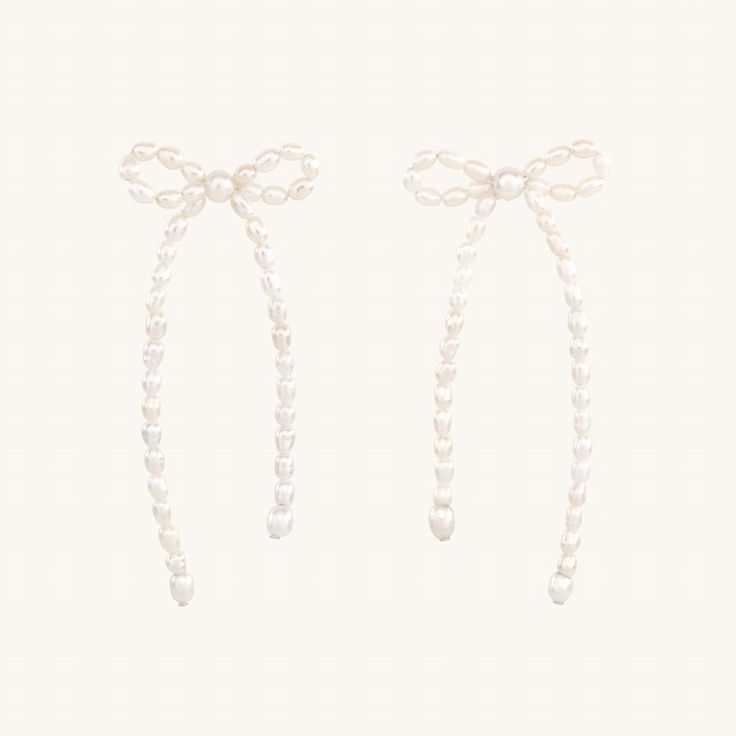 Time to tie those loose ends up into beautiful bows, the saying goes. A sweet and cleverly constructed pair of big bow earrings, made of tiny pearls. We worked with designer Kara Yoo on this specially-sized version, perfect to bring delight to your everyday. Christmas Bow Earrings, White Pearl Earrings With Bow For Wedding, White Pearl Earrings With Bow For Party, Formal Pearl Earrings With Bow Detail, Formal Pearl Earrings With Bow, Elegant Bow Pearl Earrings, Elegant Bow Tie Earrings For Wedding, Personalized Charm Necklace, Body Decor