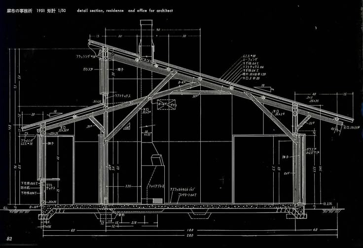 a black and white drawing of a building with blueprints on the front side