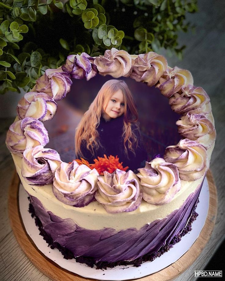 a cake decorated with purple and white icing