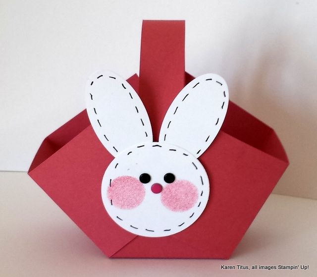 an origami rabbit made out of red paper